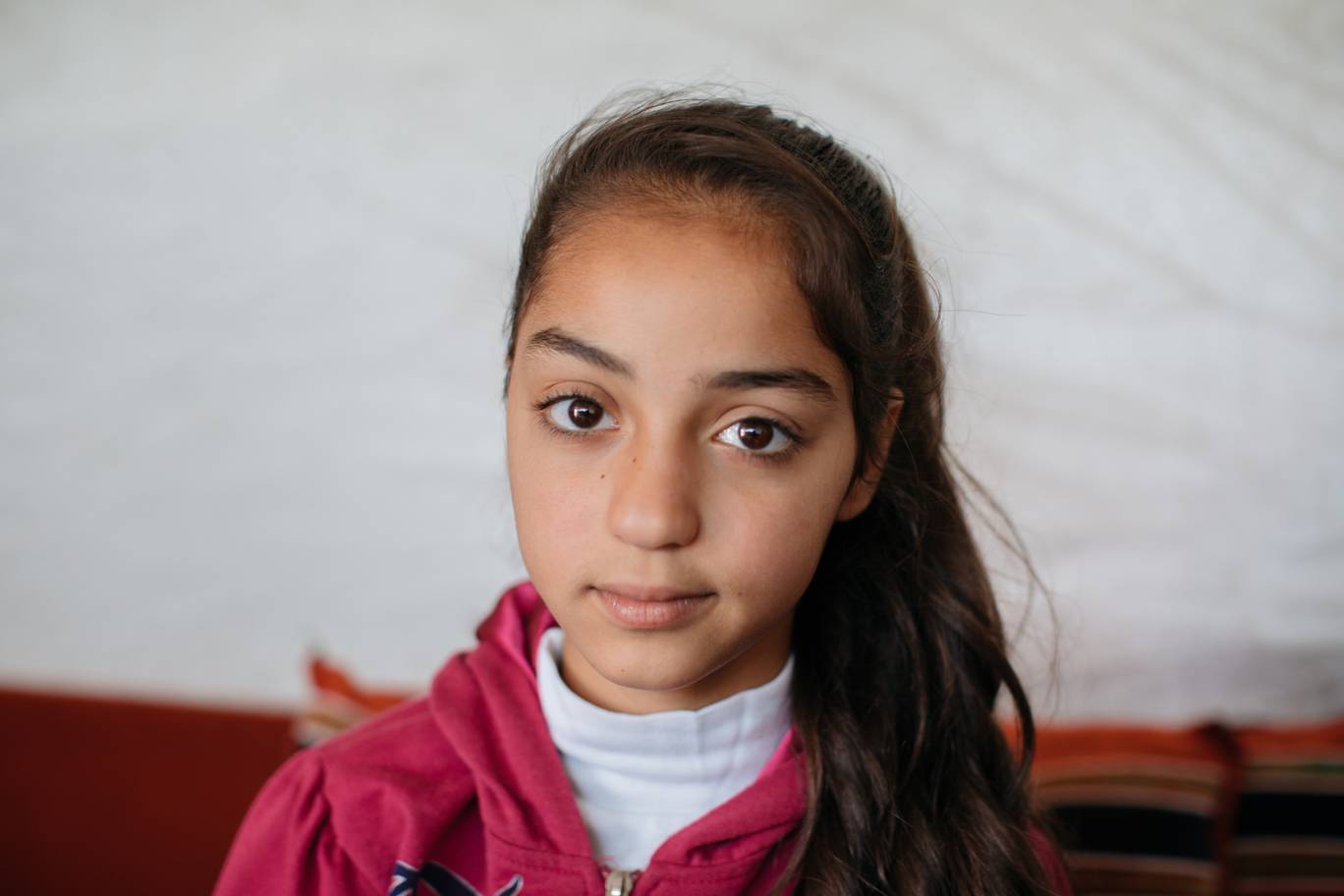 Sara, 11, is a Syrian refugee living in Lebanon’s Bekaa Valley in an informal tented settlement. She attends UNRWA-funded Jefna school where she is top of her class and regarded as the brightest child in the school by her teachers - Photo by Paddy Dowling