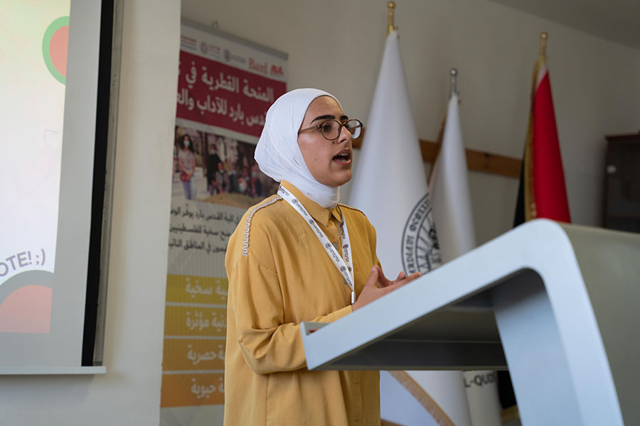 Female student speaking at an event.