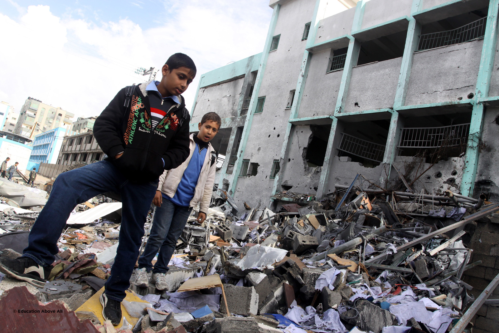 Boys walk past their school, Gaza.  Photo: © EAA