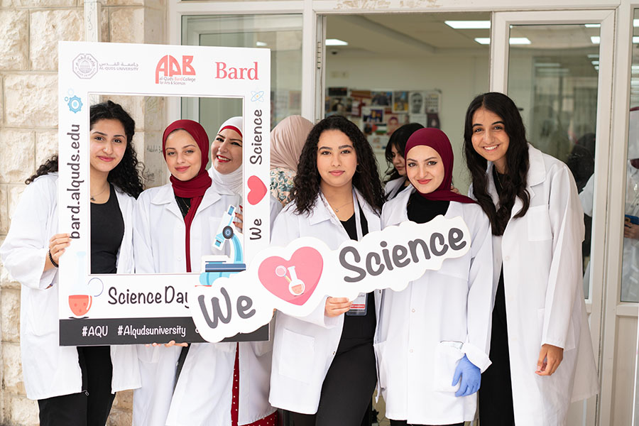 5 female science students showing their spirit on Science Day