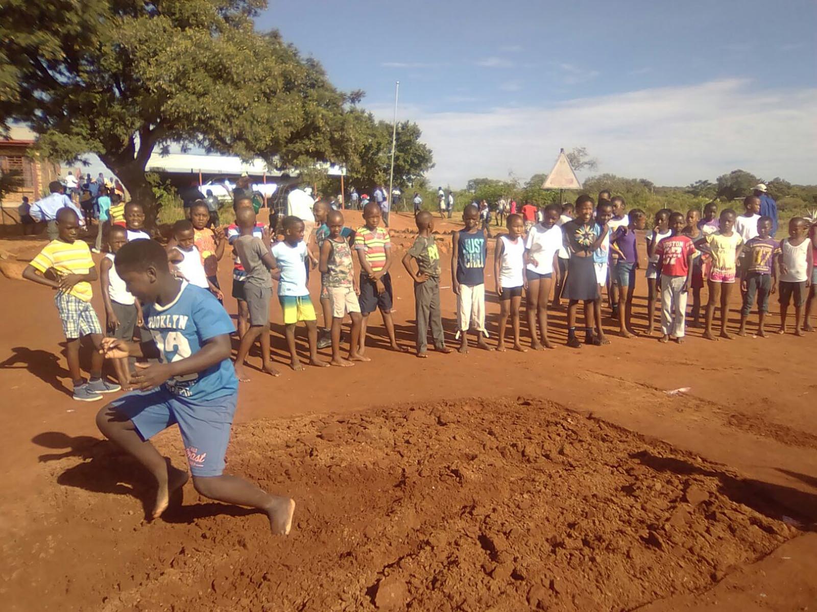 © MEIT - Children long jumping on Sports Day, Bojanala